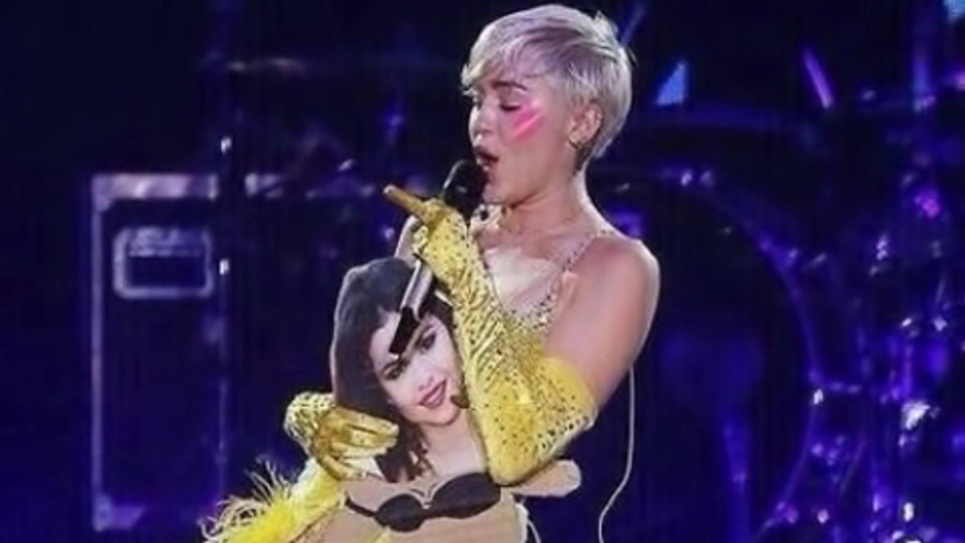 Miley Cyrus Throws Selena Gomez Photo During Concert