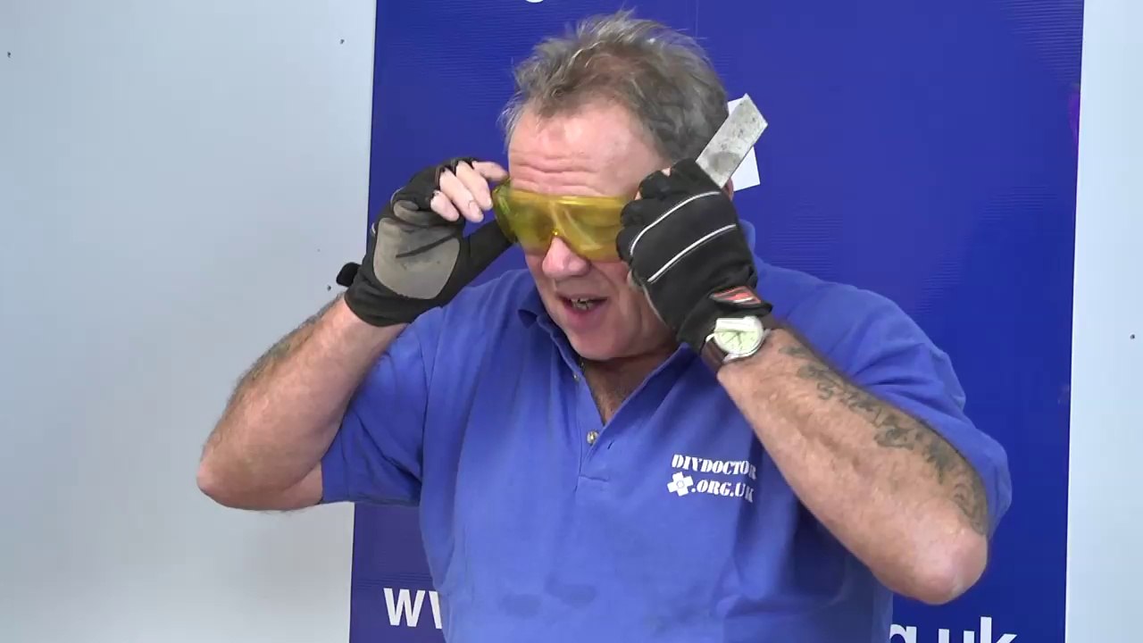 How to chop putty from window frames using a hacking or chopping knife.