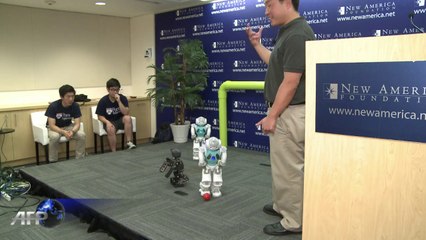 US students show off robots playing football