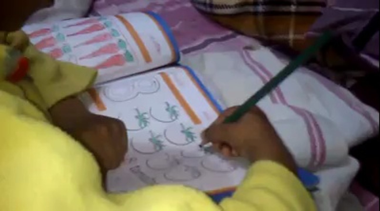 muhammad abdullah irfan mughal, mananwala, district sheikhupura, doing home work, june 2014