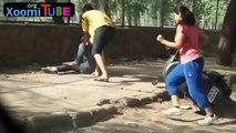 Indian girls chase down boy on scooter and give him a beating