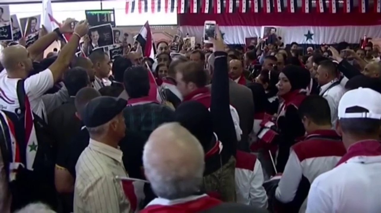 Syrians vote in historic election amid civil war