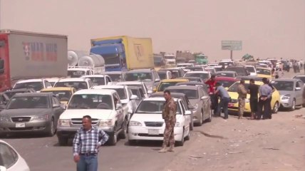 Raw: Thousands flee Mosul violence