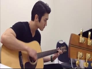 Siwon playing guitar