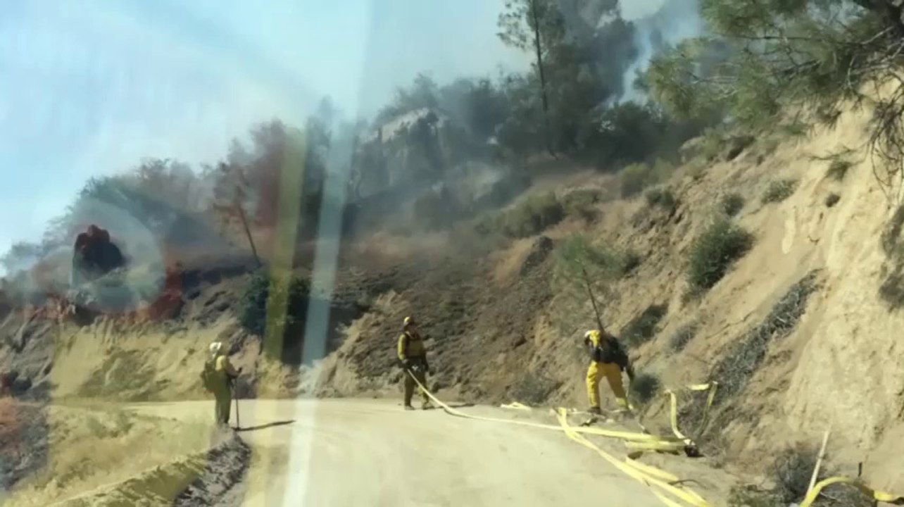 Raw: Calif. fire grows slightly, threatens homes