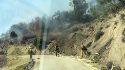 Raw: Calif. fire grows slightly, threatens homes