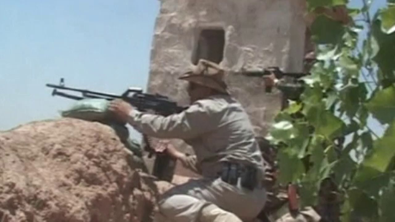 Iraq's Kurds fire weapons and rockets in intense firefight