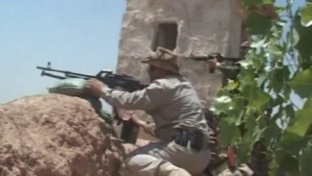 Iraq's Kurds fire weapons and rockets in intense firefight