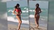 Claudia Romani Enjoys The Beach Despite A Near Wardrobe Malfunction