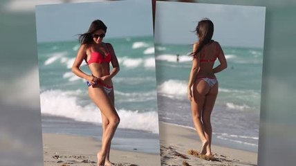 Claudia Romani Enjoys The Beach Despite A Near Wardrobe Malfunction