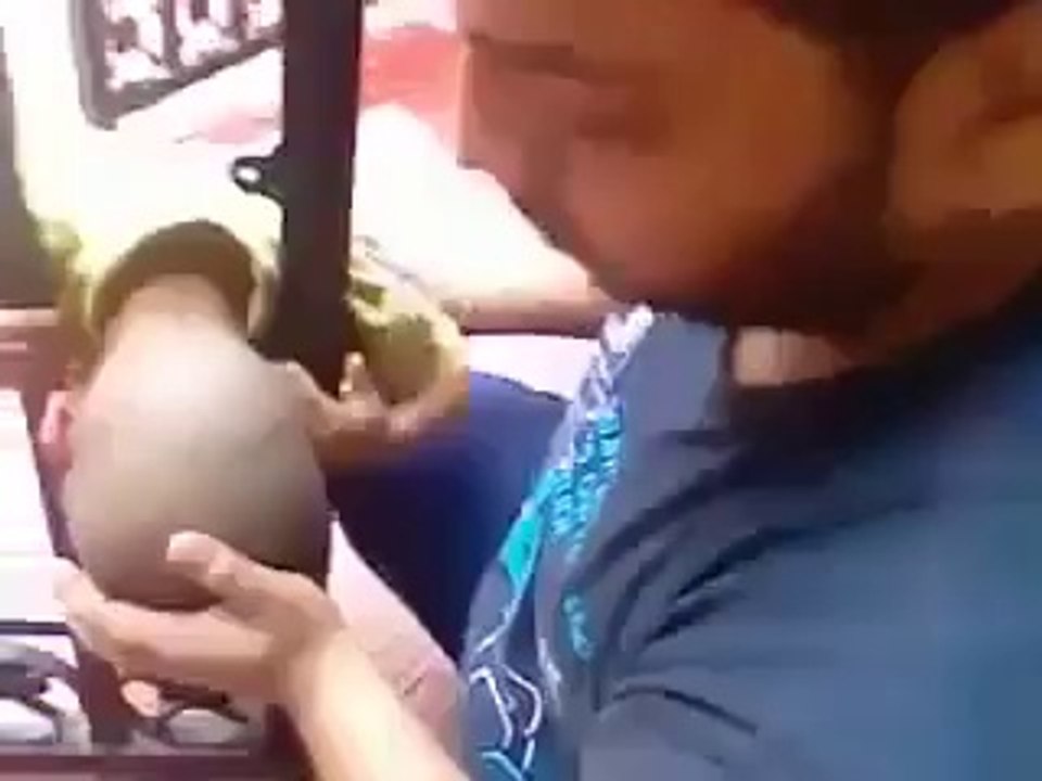 child caught in iron rods of gate