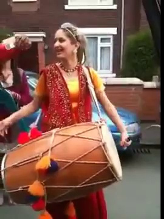a girl drumming in the public