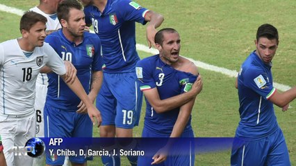 Football: Suarez risks World Cup ban after Italy bite