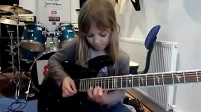 8-Year-Old Girl Shreds Guitar