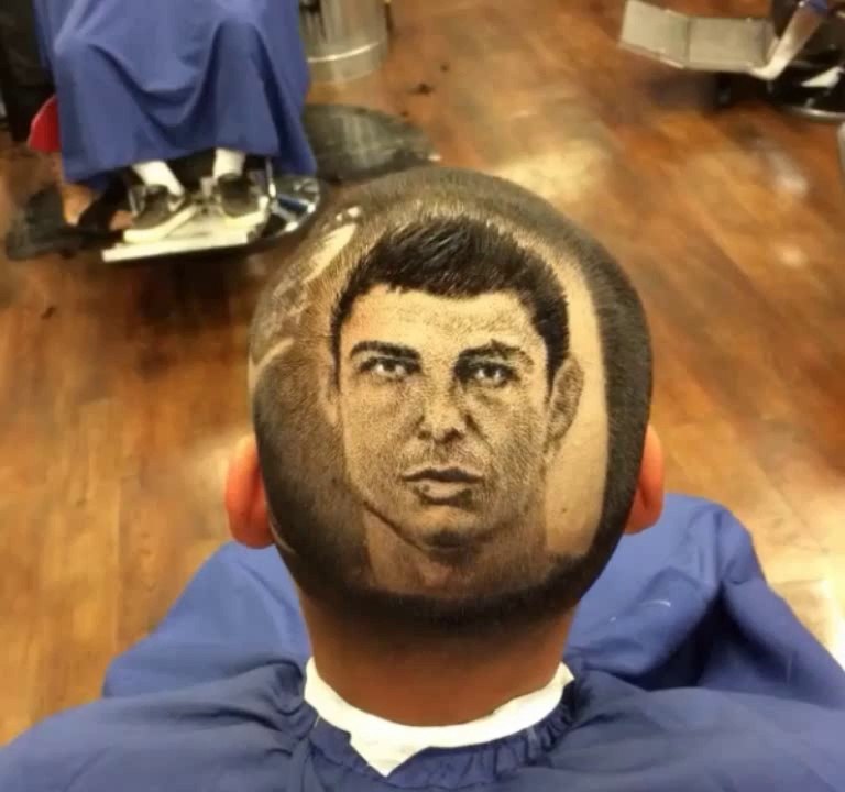 Barber extraordinaire 'Rob the Original' shaves Cristiano Ronaldo into a fan's head