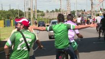 Fans on bikes hitch rides to World Cup stadium