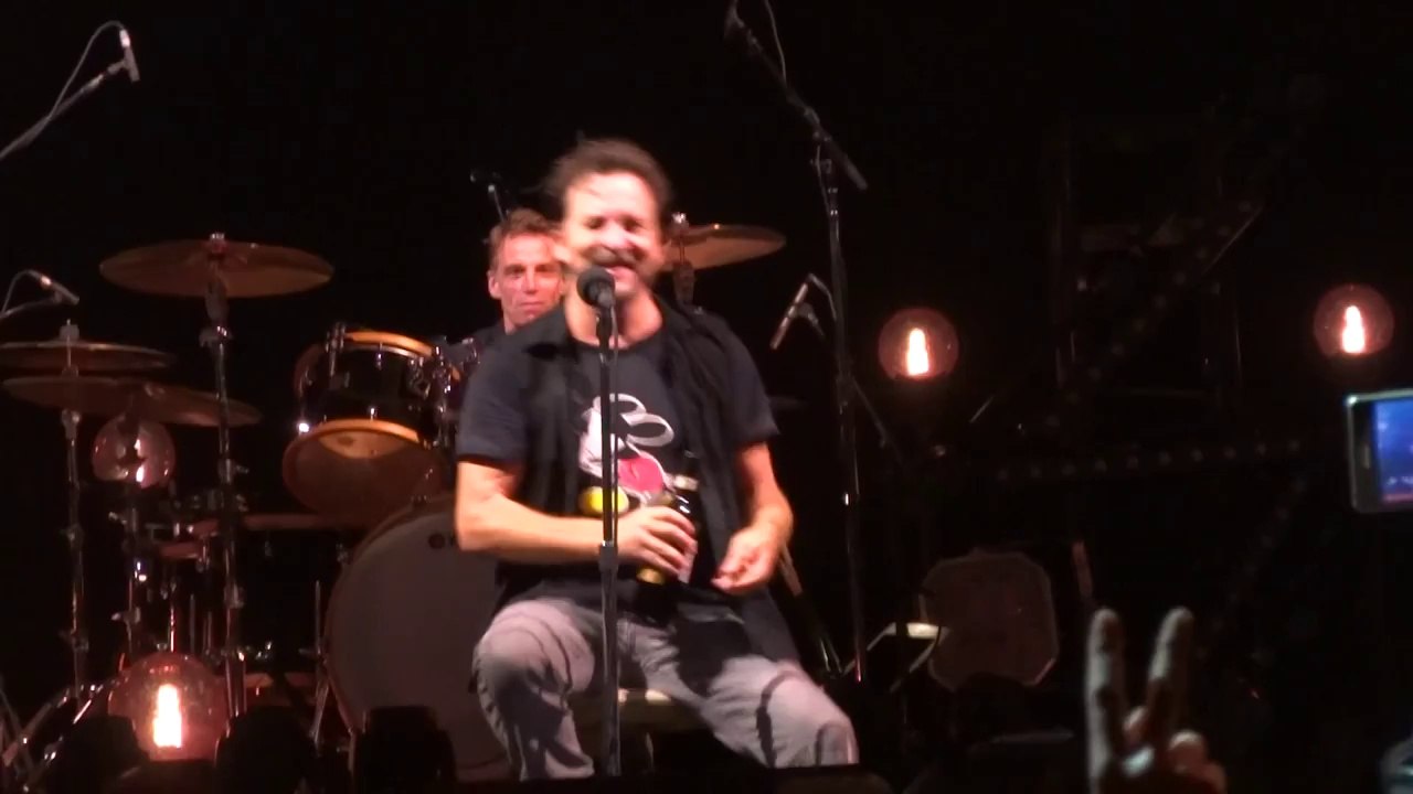Pearl Jam singer Eddie Vedder drinking wine from a fan shoe in stockholm festival