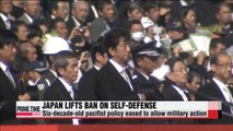 Japan adopts resolution allowing collective self-defense (2)