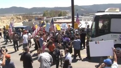 Several buses buses carrying migrants arrive in California after being blocked by protestors.