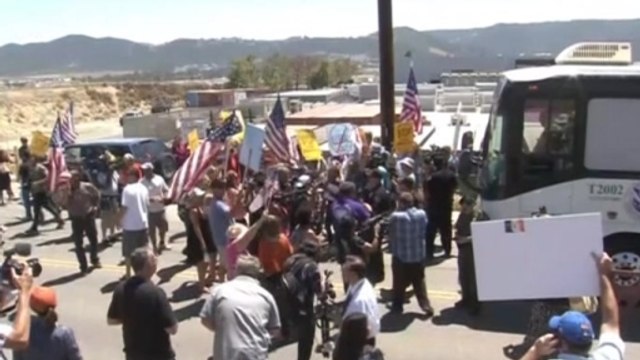 Several buses buses carrying migrants arrive in California after being blocked by protestors.