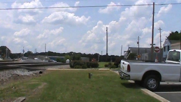 BNSF power leading NS 735 coal train SB meets UP power leading NS 23N Intermodal Train NB in Austell Ga.