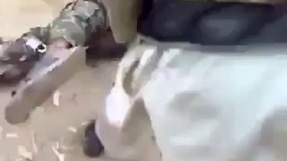 Wahabi Mullah of Pakistani Taliban brutally torturing the Pakistan Army Soldier