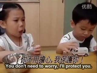 Little boy Comforts Girl On First Day Of Kindergarten In China