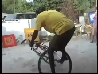 cool guy dancing on bicycle.
