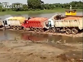 funny fall down of trucks in to water very funny.