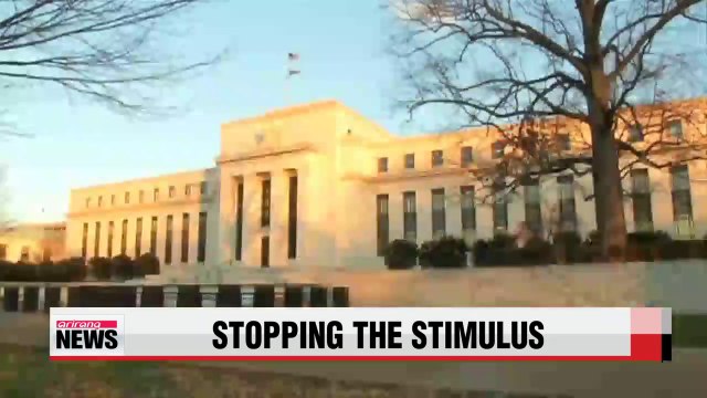 U.S. Fed sets October as end of bond buying program