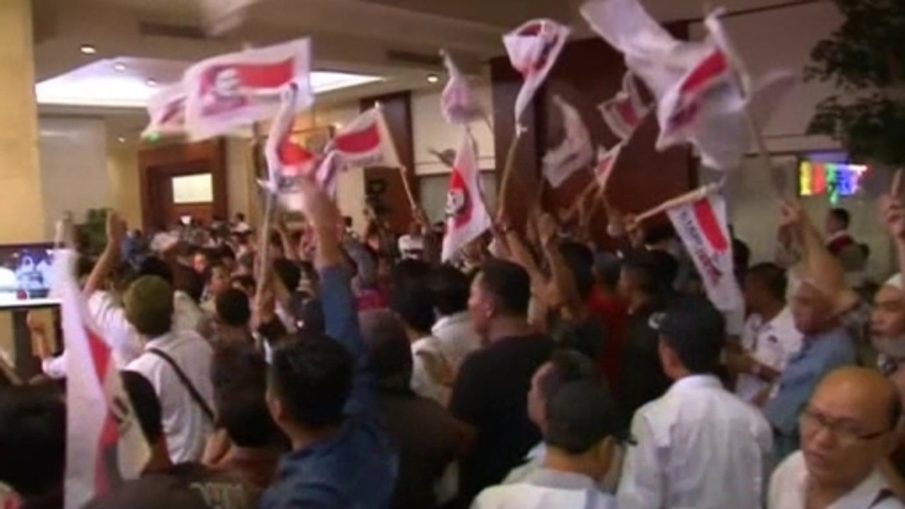 Indonesian presidential candidates both celebrate victory