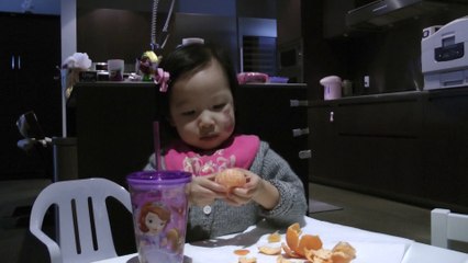 Girl Eating Orange
