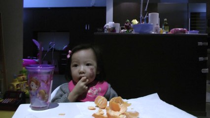 Girl Eating Orange