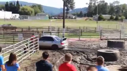 Subaru Impreza Battles It's Way Out Of A Large Mud-Pit