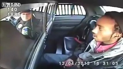 Stupid Criminal Pulls Gun In Back Seat of Police Car