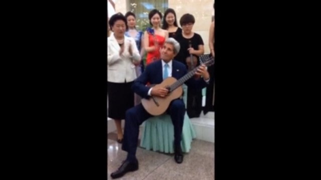 Kerry plays classical guitar in China