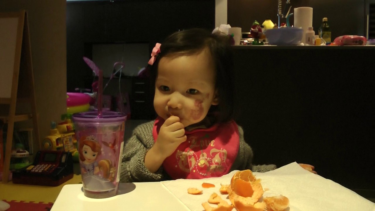Girl Eating Orange