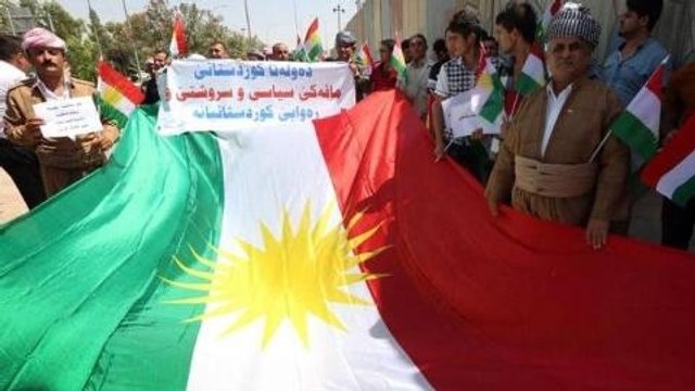 Kurds fight Iraqi government and rebels for territory