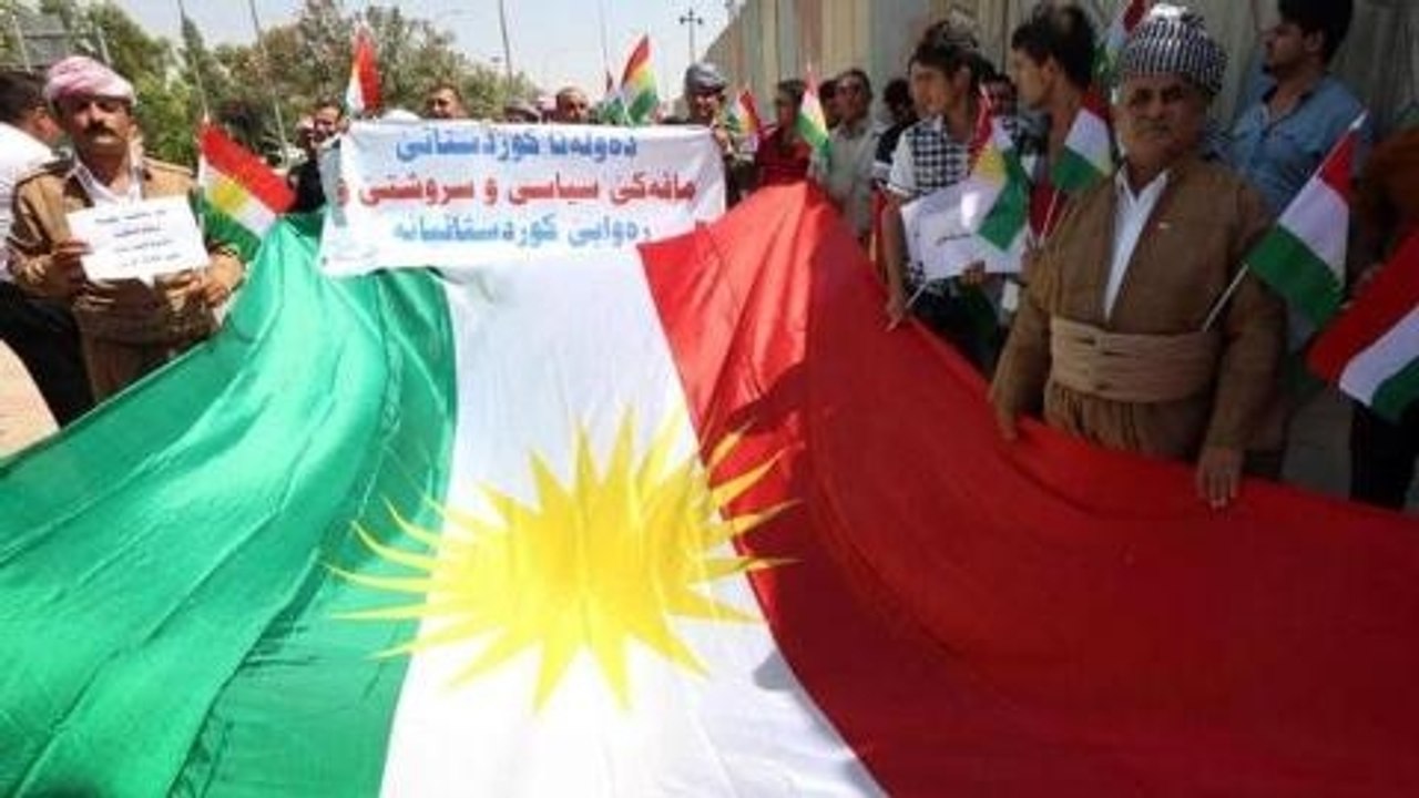 Kurds fight Iraqi government and rebels for ter...