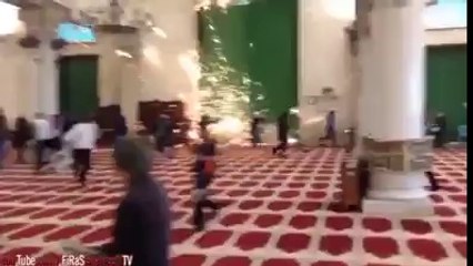 Israeli police attacking worshipers in Masjid Al-Aqsa.
