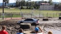 Subaru Impreza battles large mud pit