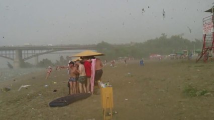 Russian Beachgoers Caught In Powerful Hail Storm