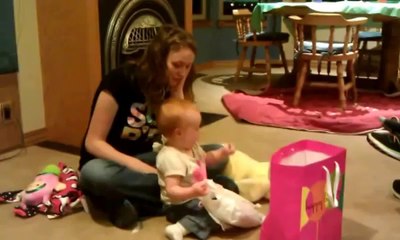 First Birthday Party Opening Presents and Loving It