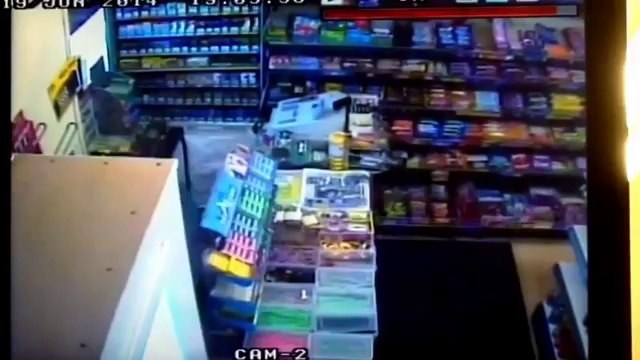 CCTV footage of robbery and shopkeeper fought off the robber with wooden pole