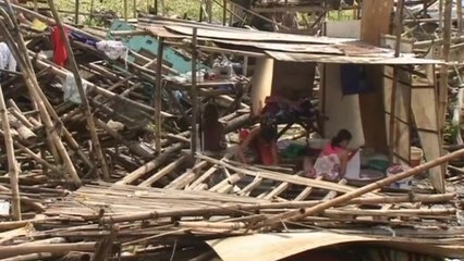 Filipino residents assess damage of Typhoon Rammasun