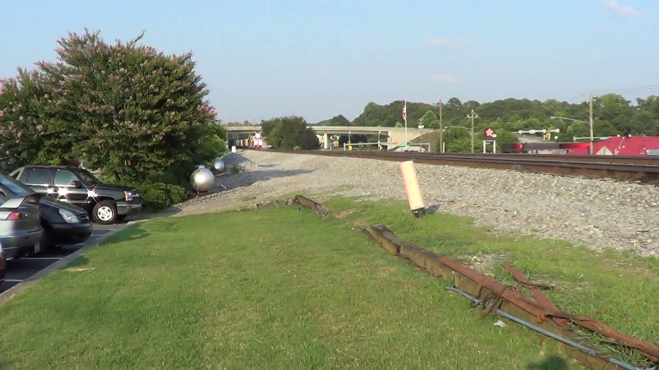 BNSF power leads NS 737 coal train NB through Austell Ga.