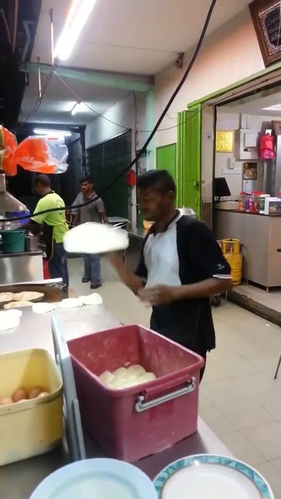 Men Playing with Roti