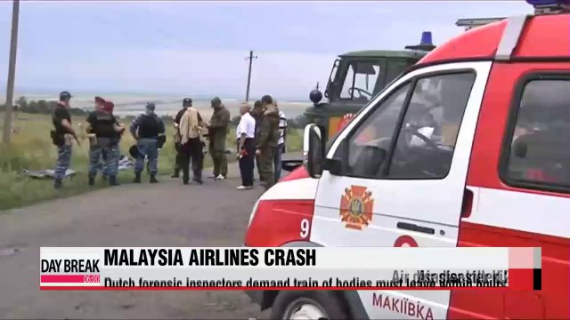 Dutch investigators demand MH17 bodies leave immediately