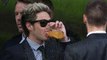One Directions Louis Tomlinson put on a dapper display as band mates attend his mothers weddin... (HD)