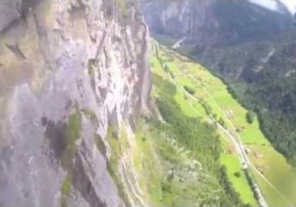 Wingsuit Flight Through a Swiss Waterfall